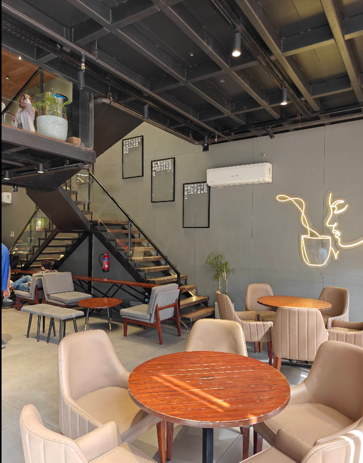 Upstairs seating with neon face artwork